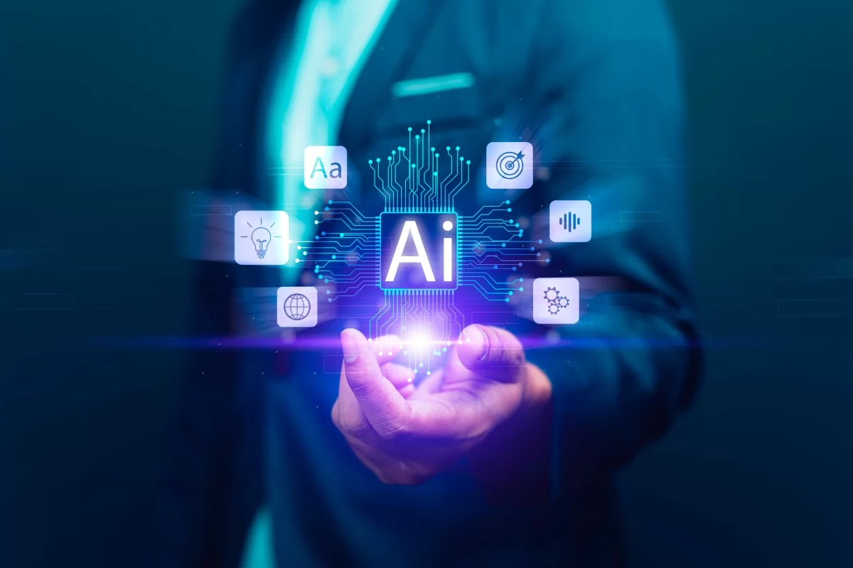 A imagem mostra um homem usando roupa social. Ele está com a mão esquerda a frente de seu corpo, ela está entreaberta e dela saem representações em forma de holograma que simbolizam um ecossistema processado por Inteligência Artificial.